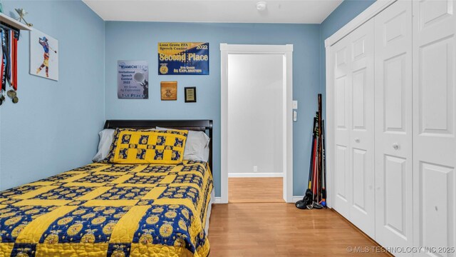 36953 US Highway 70, Bennington, OK 74723 - bedroom featuring wood finished floors and a closet