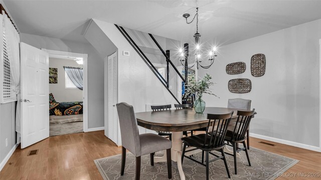 36953 US Highway 70, Bennington, OK 74723 - dining space with wood finished floors, baseboards, and a chandelier