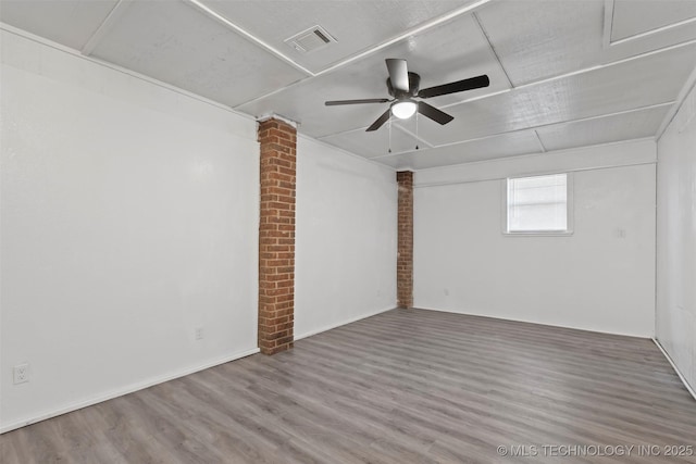 unfurnished room featuring visible vents, ceiling fan, and wood finished floors