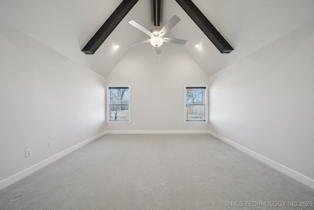 spare room featuring plenty of natural light, high vaulted ceiling, and beamed ceiling