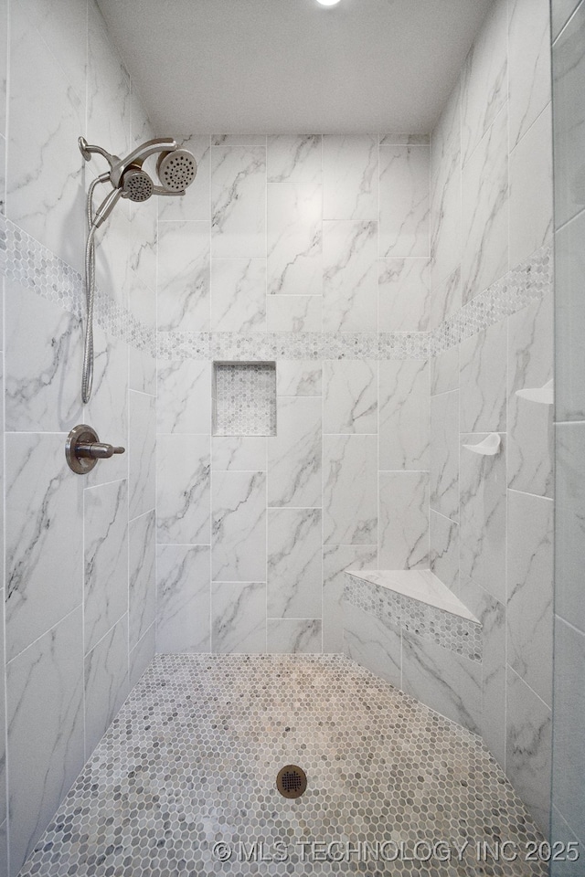 bathroom featuring tiled shower