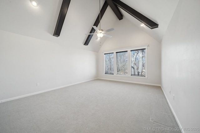 carpeted spare room with high vaulted ceiling, beam ceiling, ceiling fan, and baseboards