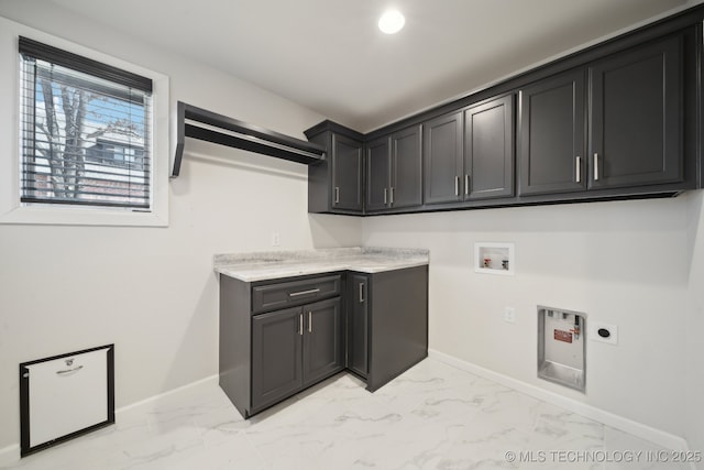 laundry area with marble finish floor, hookup for a washing machine, cabinet space, and hookup for an electric dryer