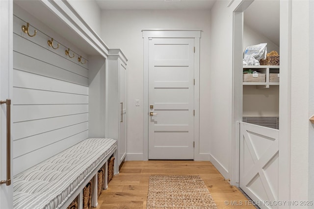 mudroom with light wood-style flooring and baseboards