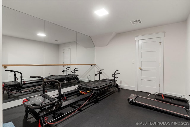 exercise area featuring baseboards and visible vents