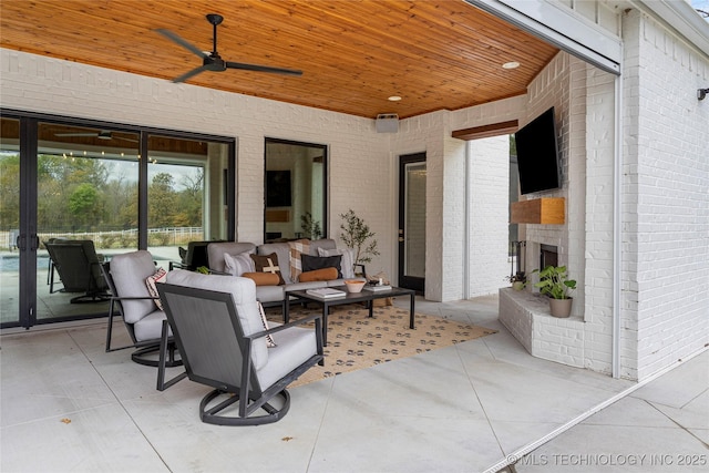 view of patio with ceiling fan and an outdoor living space