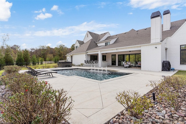 view of pool featuring a fenced in pool, a hot tub, a ceiling fan, a patio area, and fence