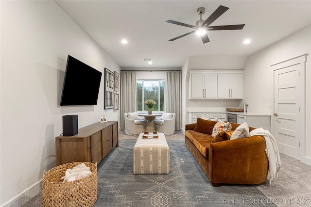 living area featuring a ceiling fan and recessed lighting