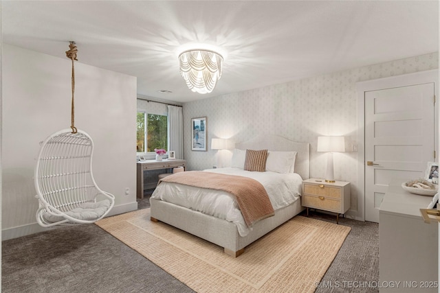 carpeted bedroom with wallpapered walls and baseboards