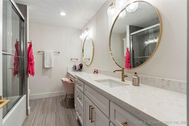 full bathroom with baseboards, toilet, wood finished floors, vanity, and recessed lighting