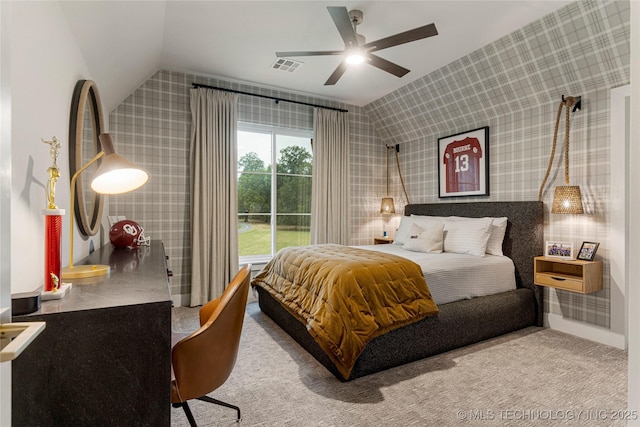 carpeted bedroom with lofted ceiling, a ceiling fan, visible vents, and wallpapered walls