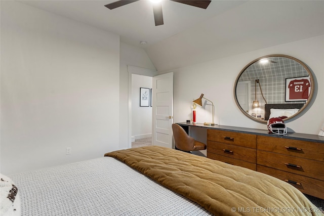 carpeted bedroom with vaulted ceiling, a ceiling fan, and baseboards