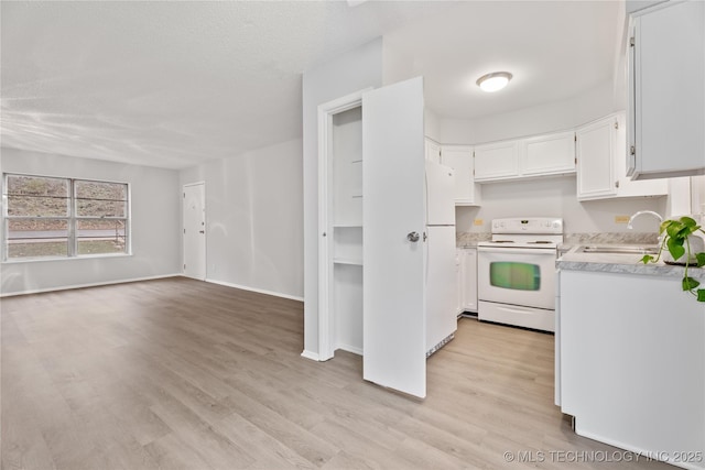 kitchen with light countertops, a sink, white cabinetry, light wood-style flooring, and white appliances