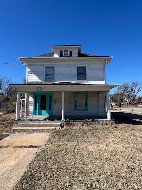 rear view of house with a porch