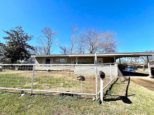 view of front of property featuring an attached carport and concrete driveway