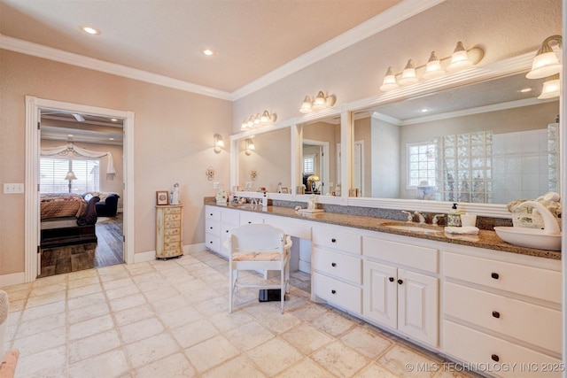 bathroom with ornamental molding, tile patterned floors, baseboards, and ensuite bathroom