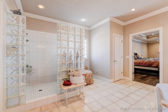 ensuite bathroom featuring a walk in shower, a textured ceiling, connected bathroom, baseboards, and ornamental molding