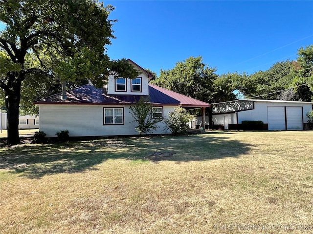 view of front of home with metal roof and a front lawn