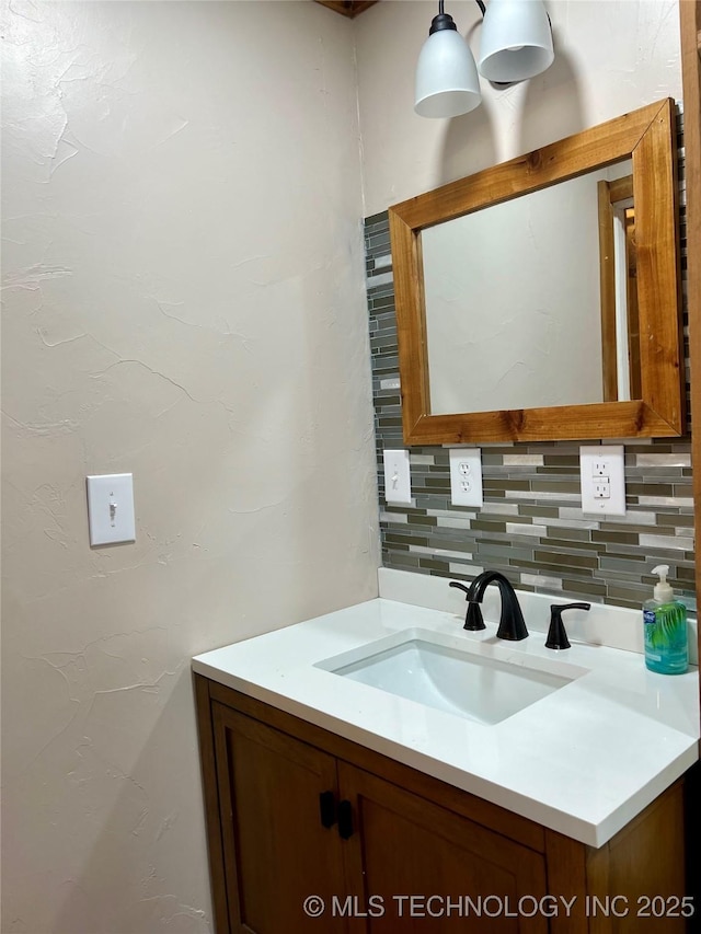 bathroom with decorative backsplash and vanity