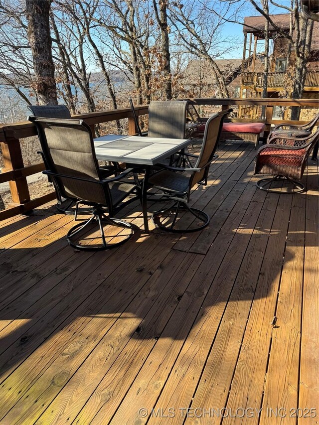 deck featuring outdoor dining area