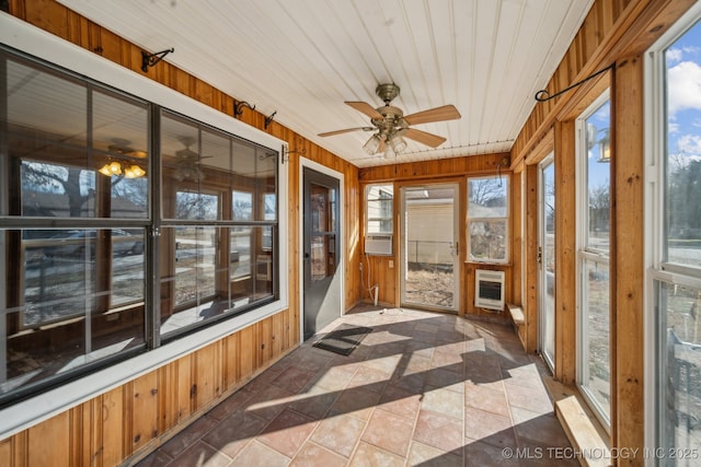 sunroom / solarium with a ceiling fan, cooling unit, wooden ceiling, and heating unit