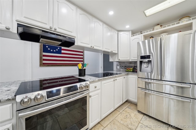 kitchen with appliances with stainless steel finishes, backsplash, white cabinetry, and under cabinet range hood