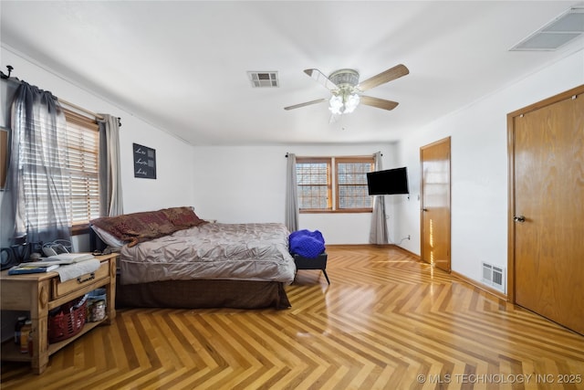 bedroom featuring a ceiling fan and visible vents