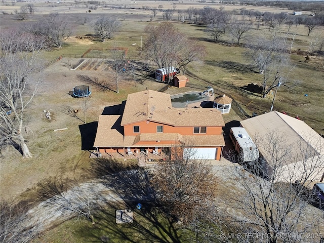 birds eye view of property featuring a rural view