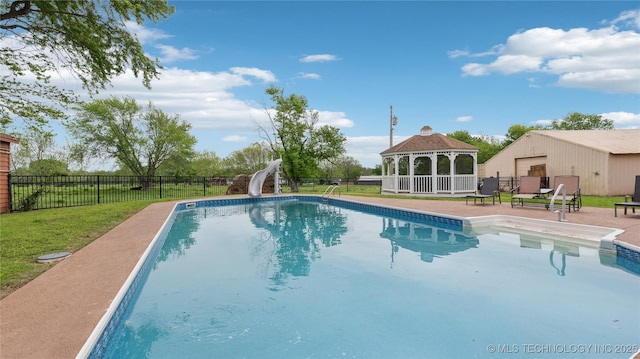 view of swimming pool featuring a water slide, fence, a gazebo, and a fenced in pool