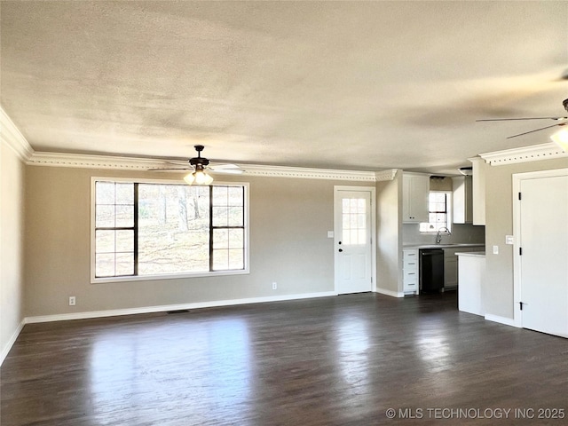 unfurnished living room with dark wood finished floors, ornamental molding, and ceiling fan