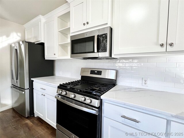 kitchen featuring open shelves, dark wood-style floors, stainless steel appliances, white cabinets, and decorative backsplash