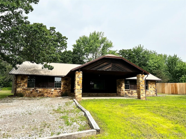 16306 N Javine Hill Rd, Skiatook, OK 74070 - view of front facade with stone siding and metal roof