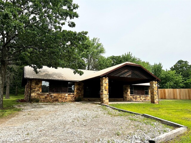 16306 N Javine Hill Rd, Skiatook, OK 74070 - view of front of home with stone siding and metal roof