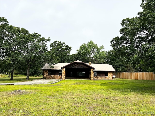 16306 N Javine Hill Rd, Skiatook, OK 74070 - view of front of house featuring stone siding, metal roof, and view of scattered trees
