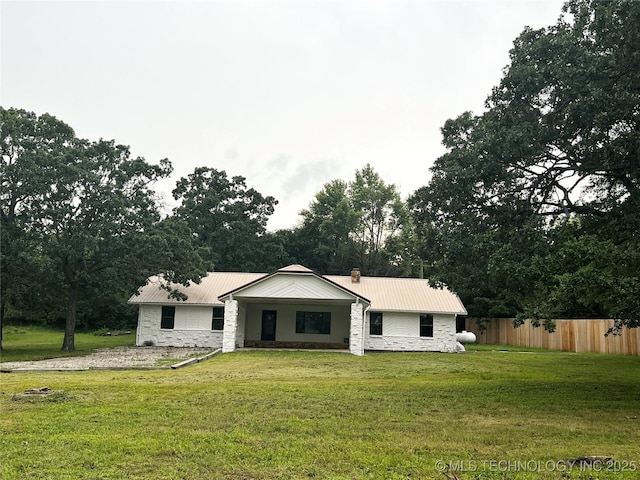 16306 N Javine Hill Rd, Skiatook, OK 74070 - view of front of home with stone siding, metal roof, and view of scattered trees