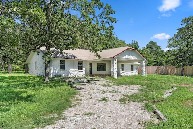 16306 N Javine Hill Rd, Skiatook, OK 74070 - view of front of house featuring a metal roof and stone siding