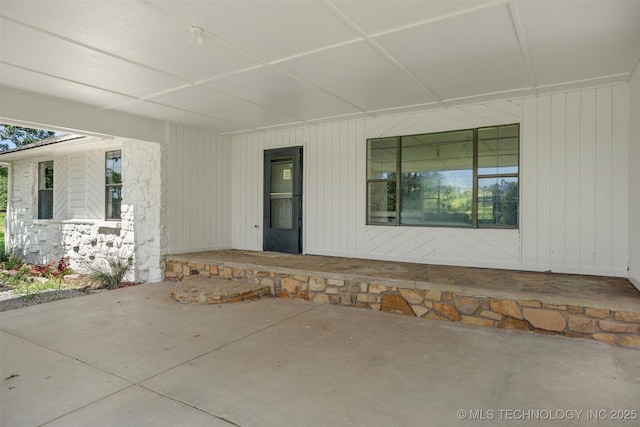 16306 N Javine Hill Rd, Skiatook, OK 74070 - entrance to property with covered porch and stone siding