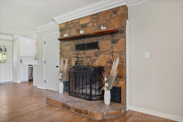 16306 N Javine Hill Rd, Skiatook, OK 74070 - detailed view of ornamental molding, wood finished floors, and a stone fireplace