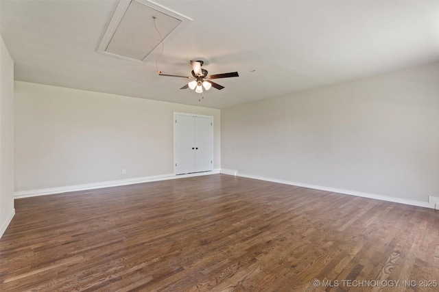16306 N Javine Hill Rd, Skiatook, OK 74070 - empty room featuring attic access, dark wood finished floors, and a ceiling fan