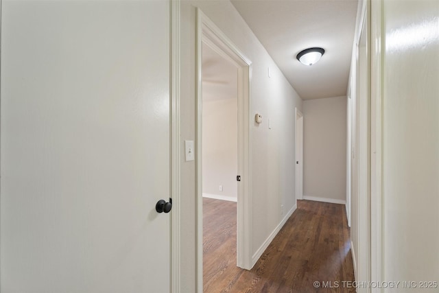 16306 N Javine Hill Rd, Skiatook, OK 74070 - hallway featuring dark wood finished floors and baseboards