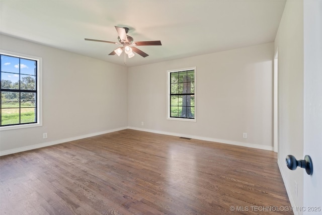 16306 N Javine Hill Rd, Skiatook, OK 74070 - spare room with a ceiling fan and wood finished floors