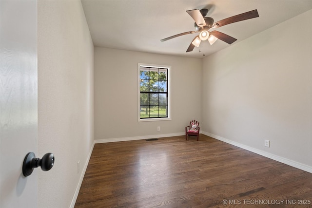 16306 N Javine Hill Rd, Skiatook, OK 74070 - spare room featuring dark wood finished floors and a ceiling fan