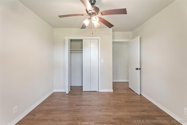 16306 N Javine Hill Rd, Skiatook, OK 74070 - unfurnished bedroom featuring wood finished floors, a closet, and a ceiling fan
