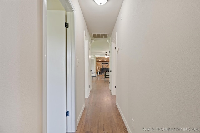16306 N Javine Hill Rd, Skiatook, OK 74070 - hallway with light wood-type flooring and baseboards