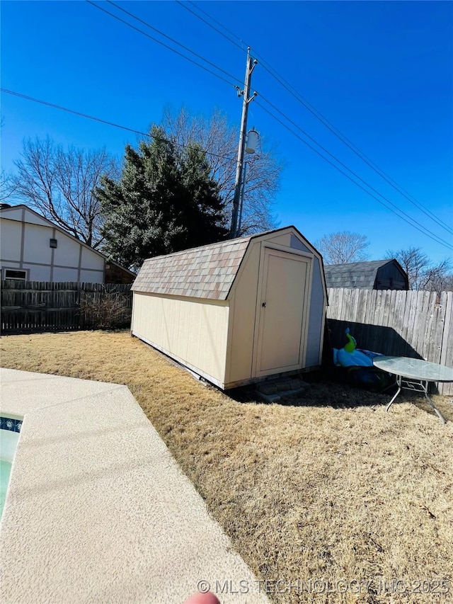 view of shed with fence