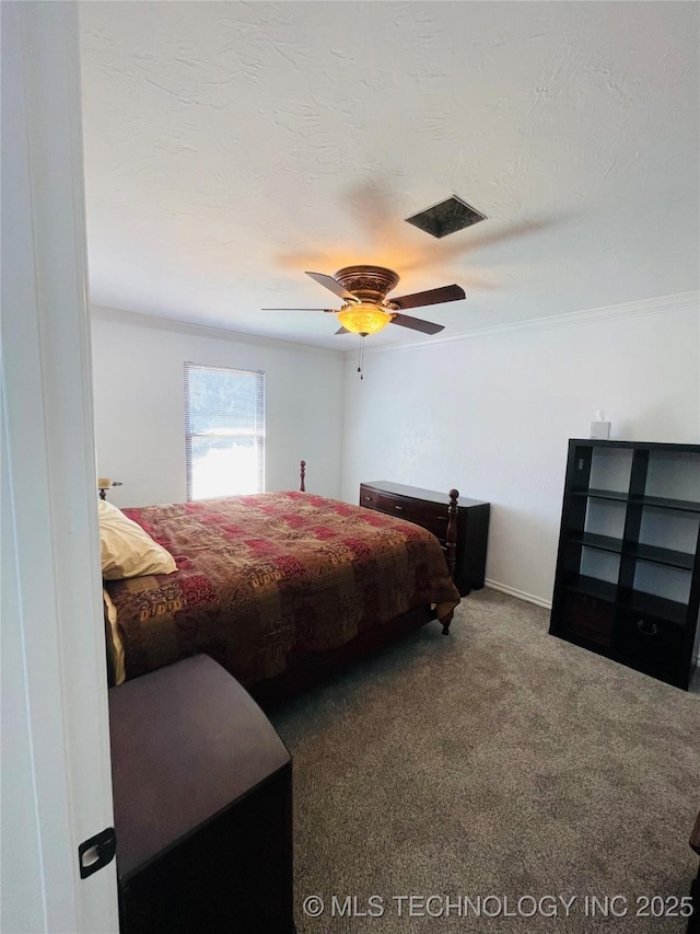 bedroom with ceiling fan, a textured ceiling, visible vents, and carpet flooring