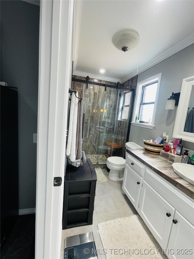 full bath featuring toilet, ornamental molding, a stall shower, vanity, and tile patterned floors