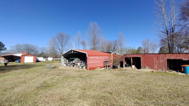 103877 US Highway 59 N, Sallisaw, OK 74955 - view of pole building featuring a detached carport and a lawn