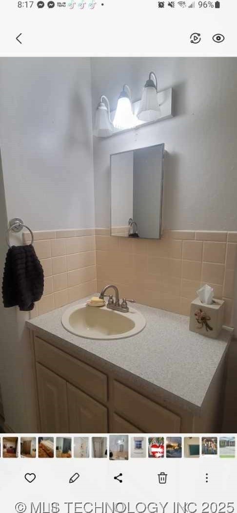 103877 US Highway 59 N, Sallisaw, OK 74955 - bathroom featuring vanity and tile walls
