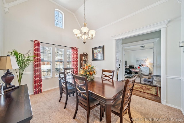 dining area featuring light carpet, an inviting chandelier, baseboards, and crown molding